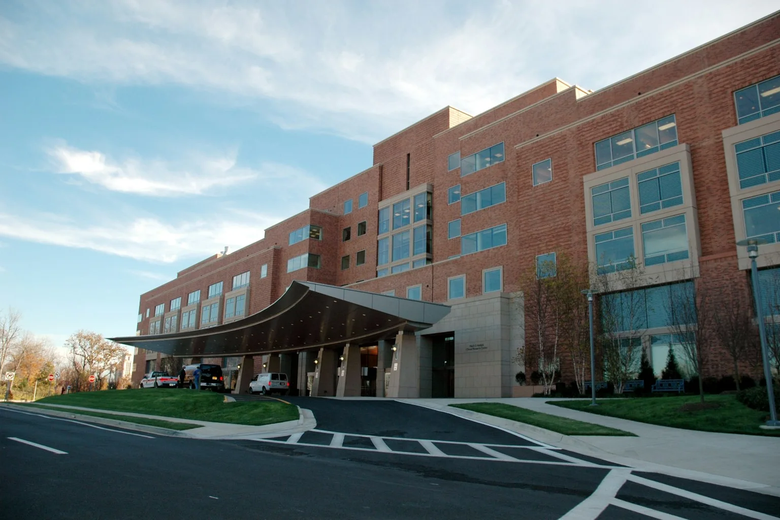 Modern hospital building exterior with clear entrance signage